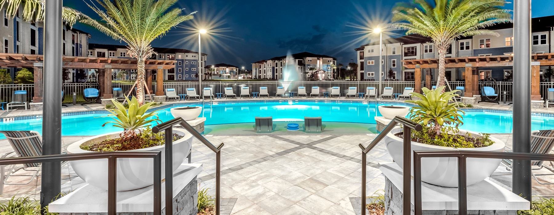 Banner Featuring Pool Deck at Dusk